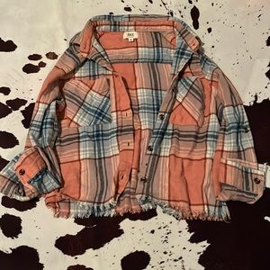 this is a pink, white and blue flannel button up